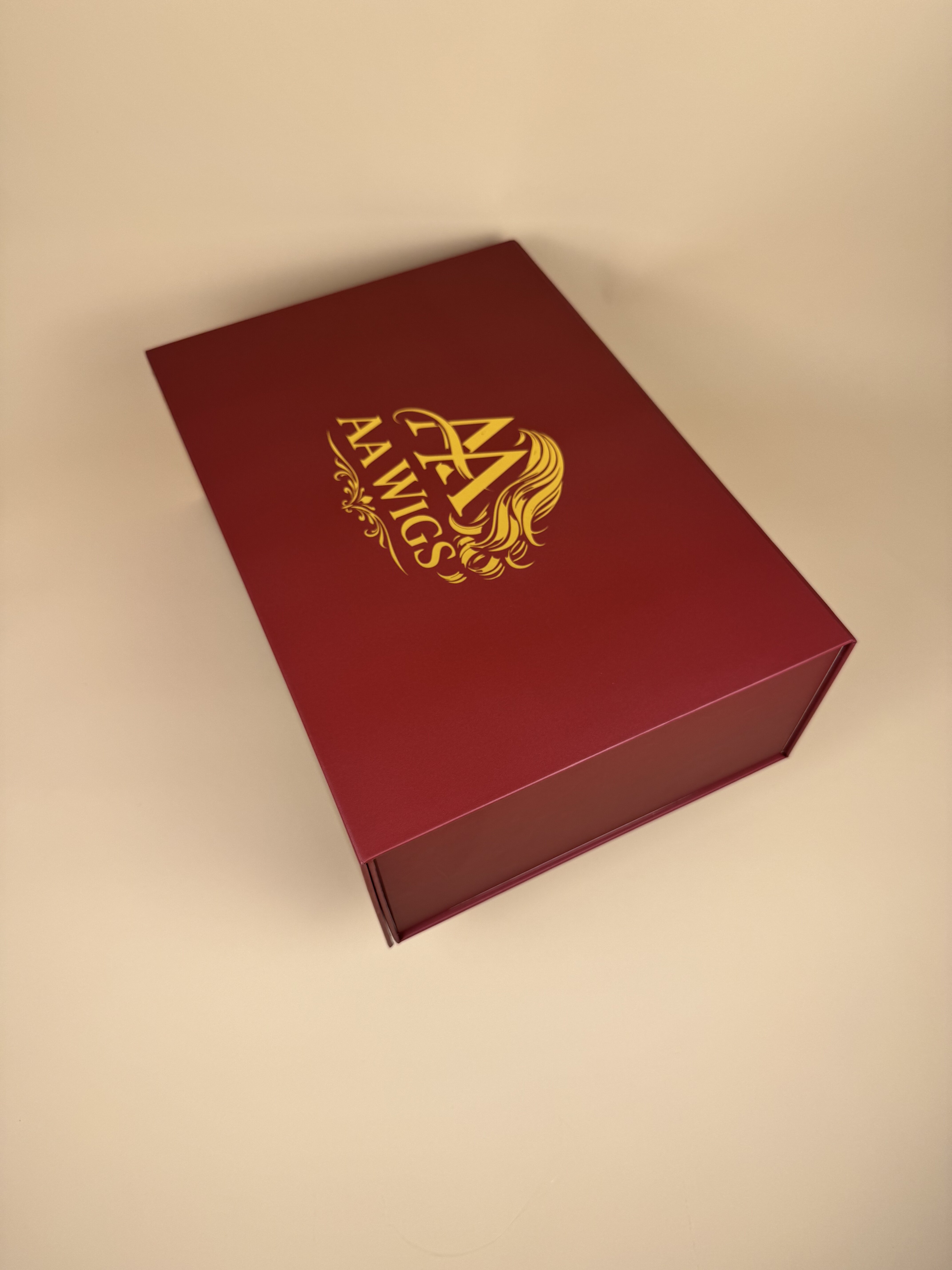 Top view of AA WIGS champagne satin box interior